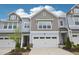 Beautiful townhome featuring a two-car garage and tasteful exterior color scheme at 1003 Canary Pepper Dr, Durham, NC 27713
