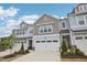 Charming townhome with a two-car garage and beautifully landscaped front yard at 1003 Canary Pepper Dr, Durham, NC 27713