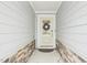 Stylish front door with a decorative wreath, creating a warm and inviting entrance at 1003 Canary Pepper Dr, Durham, NC 27713