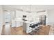 Modern kitchen featuring stainless steel appliances and a spacious island with seating at 1003 Canary Pepper Dr, Durham, NC 27713
