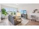 Comfortable living area with hardwood floors, natural light, and a cozy seating arrangement at 1003 Canary Pepper Dr, Durham, NC 27713