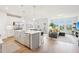 Open-concept living space seamlessly combines the kitchen, dining area, and living room for a modern and inviting atmosphere at 1003 Canary Pepper Dr, Durham, NC 27713