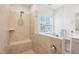 Modern shower boasts floor-to-ceiling tile and glass enclosure at 1003 Canary Pepper Dr, Durham, NC 27713