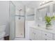 Bathroom with glass door shower, white vanity, and sink, plus a toilet at 1008 Brittley Way, Apex, NC 27502