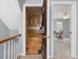 Bright bedroom features neutral carpet, two windows, and access to unfinished storage at 1008 Brittley Way, Apex, NC 27502