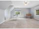 Bright bedroom features neutral carpet, a large window, and white painted walls at 1008 Brittley Way, Apex, NC 27502