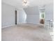 Bright bedroom features neutral carpet, a unique layout, and white painted walls at 1008 Brittley Way, Apex, NC 27502