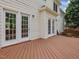 Spacious wooden deck with white siding, offering an inviting outdoor space at 1008 Brittley Way, Apex, NC 27502