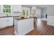 Kitchen island and sink with view of breakfast area and french doors at 1008 Brittley Way, Apex, NC 27502