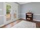 Charming room with French doors to a deck, showcasing natural light and stylish decor at 1008 Brittley Way, Apex, NC 27502