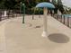 Community splash pad featuring fun water elements in a secure, fenced area providing safe and enjoyable recreation for children at 1008 Brittley Way, Apex, NC 27502