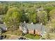 Scenic aerial view of the property, showcasing lush greenery, community pool, and well-maintained buildings at 102 Choptank Ct # B5, Cary, NC 27513