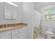 Bright bathroom featuring a floral shower curtain and updated fixtures at 102 Choptank Ct # B5, Cary, NC 27513