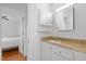 Bathroom features a granite countertop and a decorative mirror at 102 Choptank Ct # B5, Cary, NC 27513