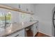 Cozy kitchen featuring granite countertops and stainless steel dishwasher at 102 Choptank Ct # B5, Cary, NC 27513