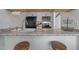 Kitchen features granite countertops, stainless steel appliances, and bar seating at 102 Choptank Ct # B5, Cary, NC 27513