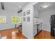 Open-concept kitchen and dining area with hardwood floors and lots of natural light at 102 Choptank Ct # B5, Cary, NC 27513