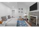 Cozy living room featuring a fireplace, hardwood floors, and a comfortable gray sofa at 102 Choptank Ct # B5, Cary, NC 27513