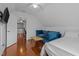 Cozy room featuring a sofa, a bed, and a doorway at 102 Choptank Ct # B5, Cary, NC 27513