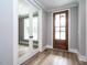 Inviting entryway featuring a stained wood door, and glass paneled french doors at 1029 Azalea Garden Cir, Raleigh, NC 27603