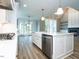 Modern kitchen with a farmhouse sink, stainless steel appliances, and an open layout for seamless living at 1029 Azalea Garden Cir, Raleigh, NC 27603