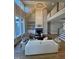 Elegant living room with soaring ceilings, fireplace, built-in shelving, and abundant natural light at 1029 Azalea Garden Cir, Raleigh, NC 27603