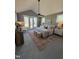 A spacious main bedroom with a sitting area, rug, and neutral decor at 1029 Azalea Garden Cir, Raleigh, NC 27603