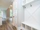 Inviting mudroom boasting custom built-ins and a stylish bench with storage compartments, perfect for organization at 1029 Azalea Garden Cir, Raleigh, NC 27603