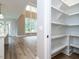 View of dining and living area, with a view of the pantry shelving at 1029 Azalea Garden Cir, Raleigh, NC 27603