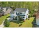 An aerial view of a two-story home with a gray roof and an attached garage at 1039 S Philwood Ct, Fuquay Varina, NC 27526