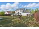 Large backyard featuring a well-maintained lawn, patio, and full wooden privacy fence at 1039 S Philwood Ct, Fuquay Varina, NC 27526