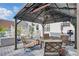 Cozy gazebo featuring comfortable seating, an overhead fan, and views of the backyard at 1039 S Philwood Ct, Fuquay Varina, NC 27526