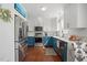 Bright kitchen with stainless steel appliances, quartz countertops, and two-tone cabinetry at 1039 S Philwood Ct, Fuquay Varina, NC 27526