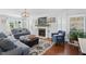 Inviting living room featuring a fireplace, shelving, and comfortable seating at 1039 S Philwood Ct, Fuquay Varina, NC 27526