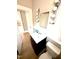 Bathroom vanity with good lighting and an adjacent toilet at 111 113 Highland Ave, Burlington, NC 27217