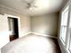 Carpeted bedroom with neutral walls and white trim and baseboards at 111 113 Highland Ave, Burlington, NC 27217