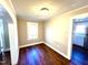 Bright room featuring freshly painted walls, wood floors and bright natural light from the window at 111 113 Highland Ave, Burlington, NC 27217
