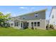 View of backyard featuring a manicured lawn and the exterior of the home at 1140 Sun Springs Rd, Wake Forest, NC 27587
