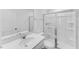 This bathroom offers a quartz vanity, shower with glass door, and modern fixtures at 1140 Sun Springs Rd, Wake Forest, NC 27587