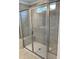 Modern bathroom with a glass-enclosed shower featuring built-in bench seating and stylish tile work at 1140 Sun Springs Rd, Wake Forest, NC 27587