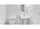 This bathroom offers a pedestal sink, commode, and simple elegant fixtures at 1140 Sun Springs Rd, Wake Forest, NC 27587