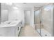 Bathroom featuring double sinks, large mirror, and a glass-enclosed shower with a built-in seat at 1140 Sun Springs Rd, Wake Forest, NC 27587