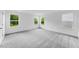 Spacious bedroom with plush carpeting and large windows offering plenty of natural light at 1140 Sun Springs Rd, Wake Forest, NC 27587