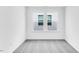Comfortable bedroom with neutral carpeting and windows offering plenty of natural light at 1140 Sun Springs Rd, Wake Forest, NC 27587