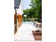 Well-maintained community area featuring an outdoor kitchen, basketball court, and lush landscaping at 1140 Sun Springs Rd, Wake Forest, NC 27587