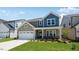 Charming exterior featuring a well-maintained lawn and an inviting porch at 1140 Sun Springs Rd, Wake Forest, NC 27587