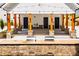 Outdoor grilling station featuring a stone facade, wooden pillars, and a built-in grill at 1140 Sun Springs Rd, Wake Forest, NC 27587