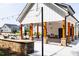 Outdoor grilling station featuring stone accents and covered shelter, ideal for outdoor gatherings at 1140 Sun Springs Rd, Wake Forest, NC 27587