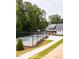 A nice pickleball court surrounded by trees and landscaping at 1140 Sun Springs Rd, Wake Forest, NC 27587