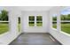 Cozy sunroom with ample windows providing natural light and views of the outdoor space at 1140 Sun Springs Rd, Wake Forest, NC 27587
